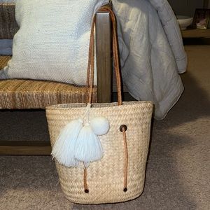 Soludos straw bag with leather handles.